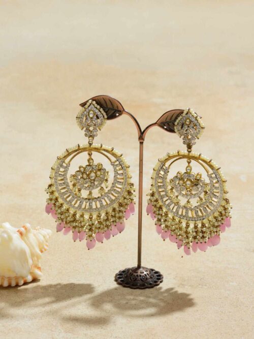 Exquisite earrings showcasing a rose-inspired centerpiece enveloped by a crescent-shaped embellished frame, exuding a blend of traditional charm and modern elegance