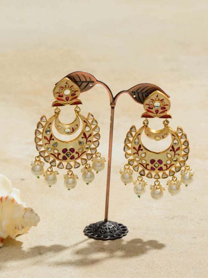 Stunning crescent-shaped earrings adorned with lustrous pearls and radiant rubies, capturing the magic of the night sky