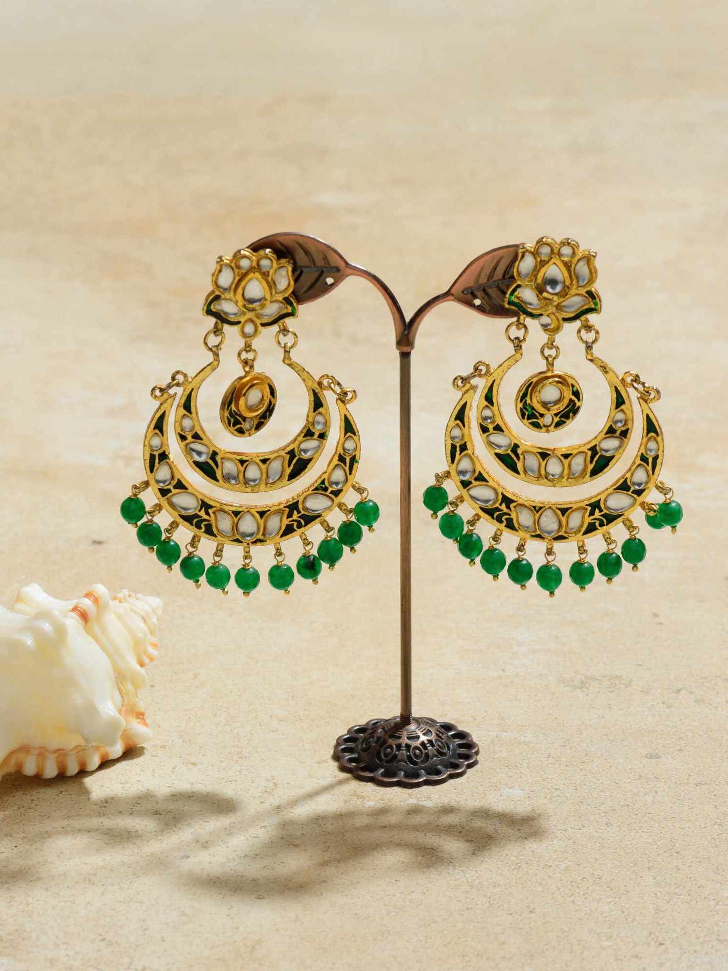 Crescent-shaped earrings infused with the luscious green of nature, reminiscent of a serene moonlit night in a lush forest, effortlessly blending tradition with a touch of mystique