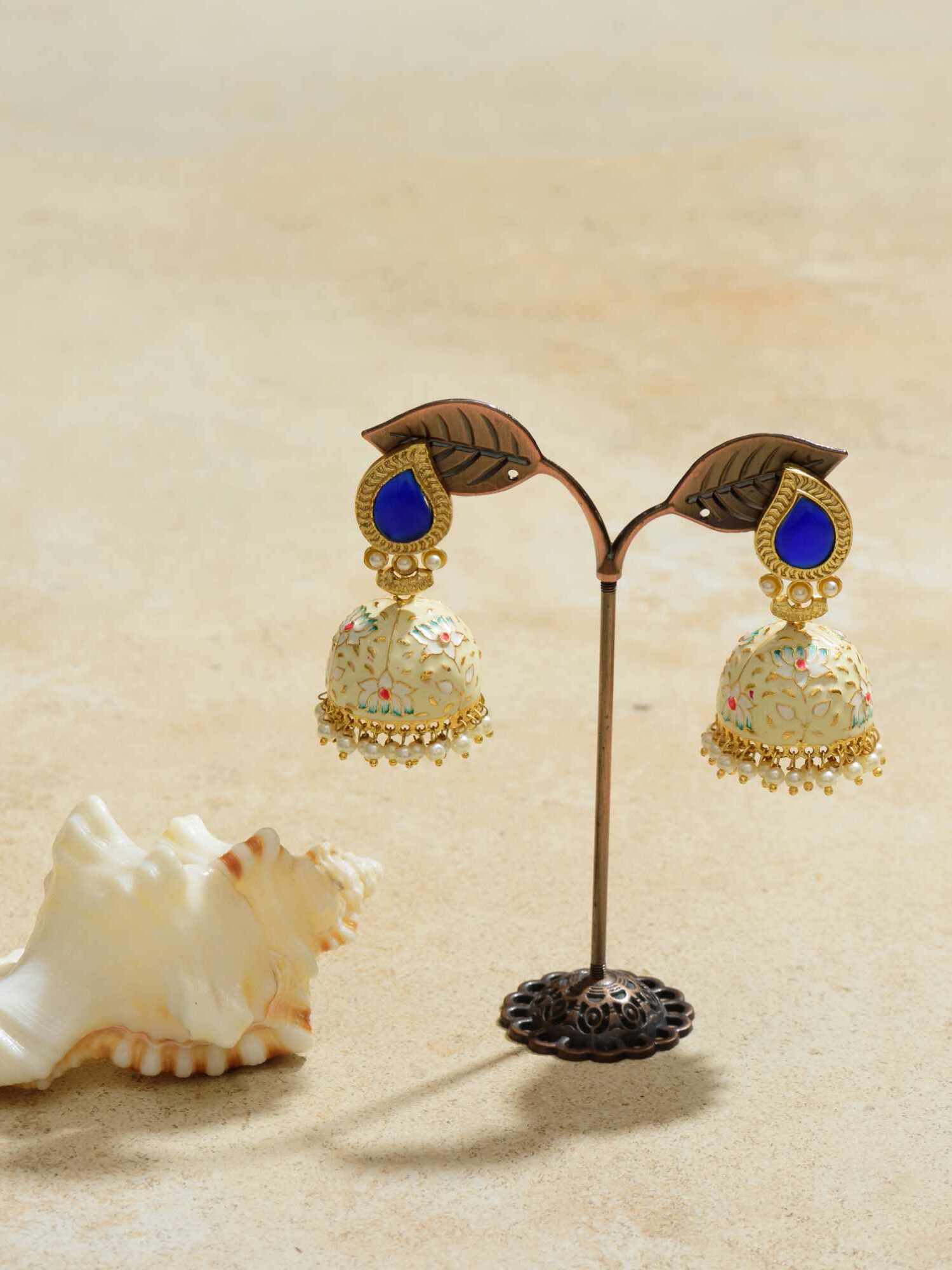 Elevate your elegance with our Blue Opal Jhumkas, where stunning blue opals meet timeless jhumka design.