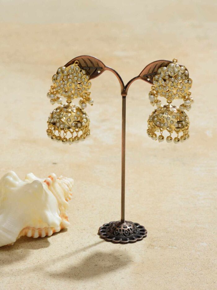 Gold jhumka earrings with sparkling champagne accents