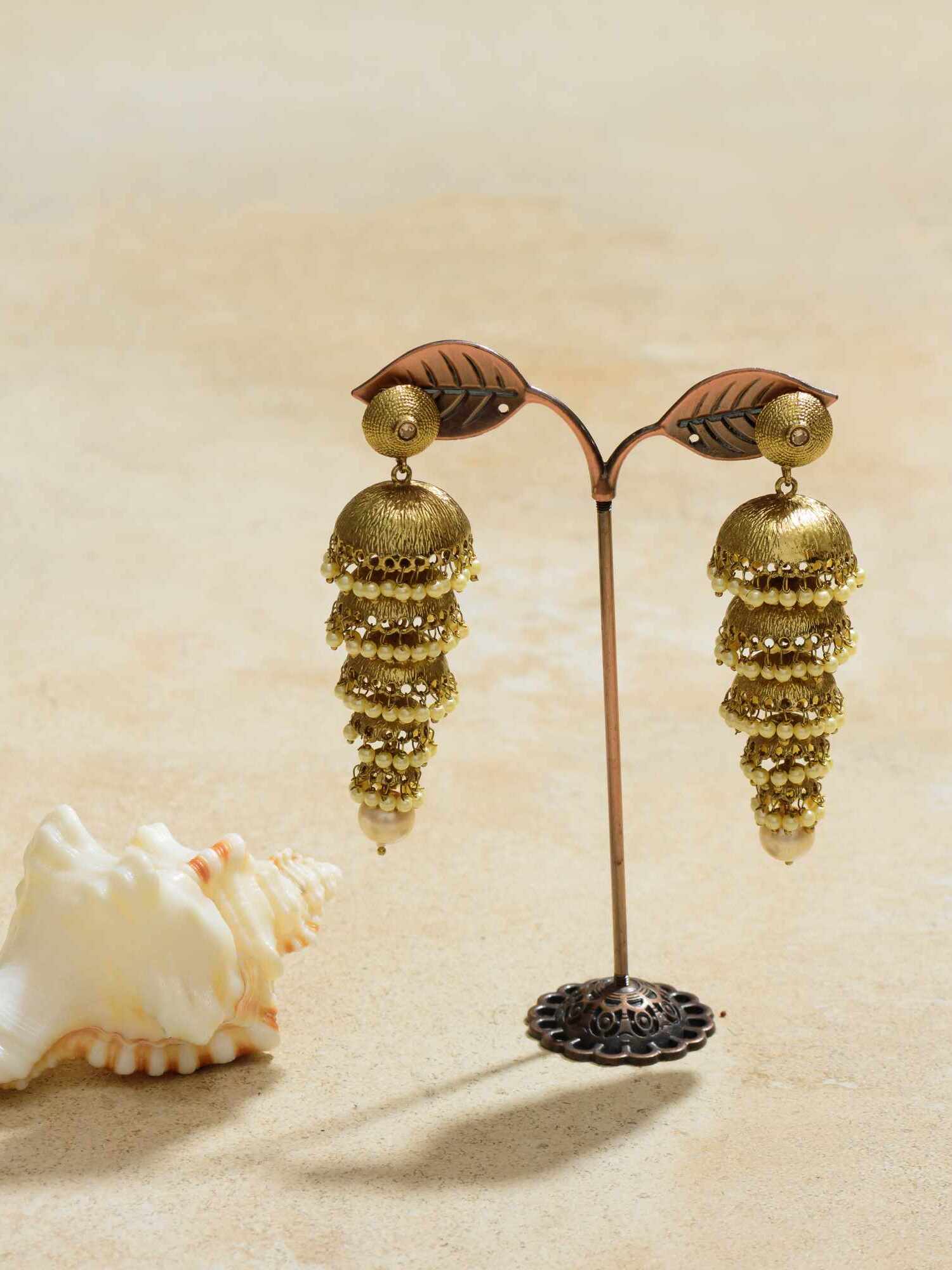 Jhumka earrings with playful dangling charms.