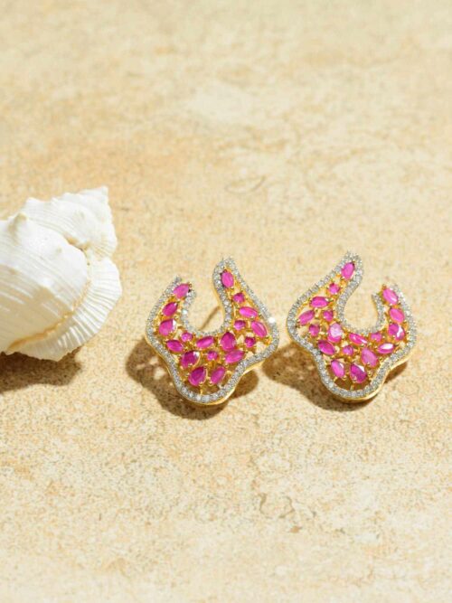 Elegantly understated earrings that emanate a captivating and radiant pink glow.