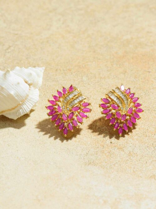 Earrings that cascade with vibrant elegance in a captivating fuchsia hue.