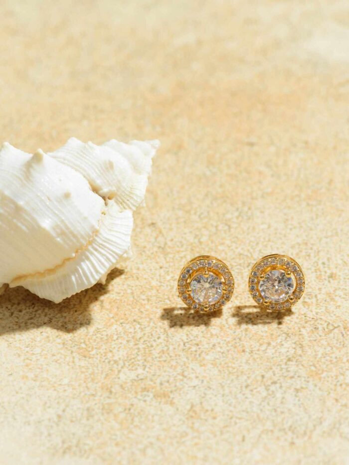 Elegant Solitaire Golden Gleam Studs: Refined Earrings with a Single Sparkling Gem.