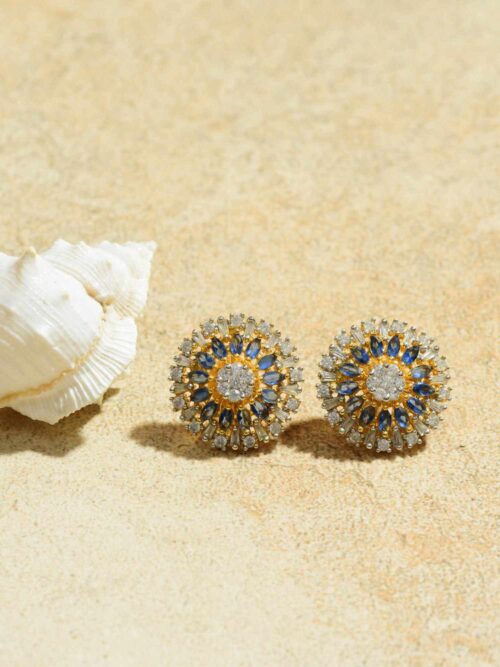 Sapphire Sunburst Studs: Radiant Earrings with a Sapphire Centerpiece.