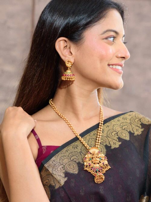 A Stunning Fusion of Gemstones and Traditional Jhumka Earrings in Honor of Goddess Lakshmi.